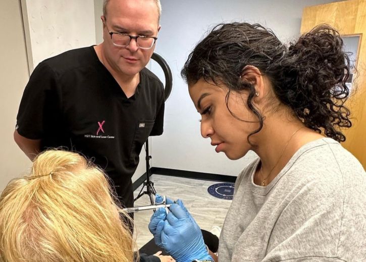 introduction to dermal fillers student model injecting a patient model